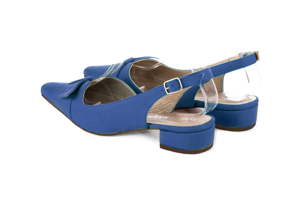 Women's electric blue slingback dress shoes, with a knot on the front. Tapered toe. Low block heels - Rear view